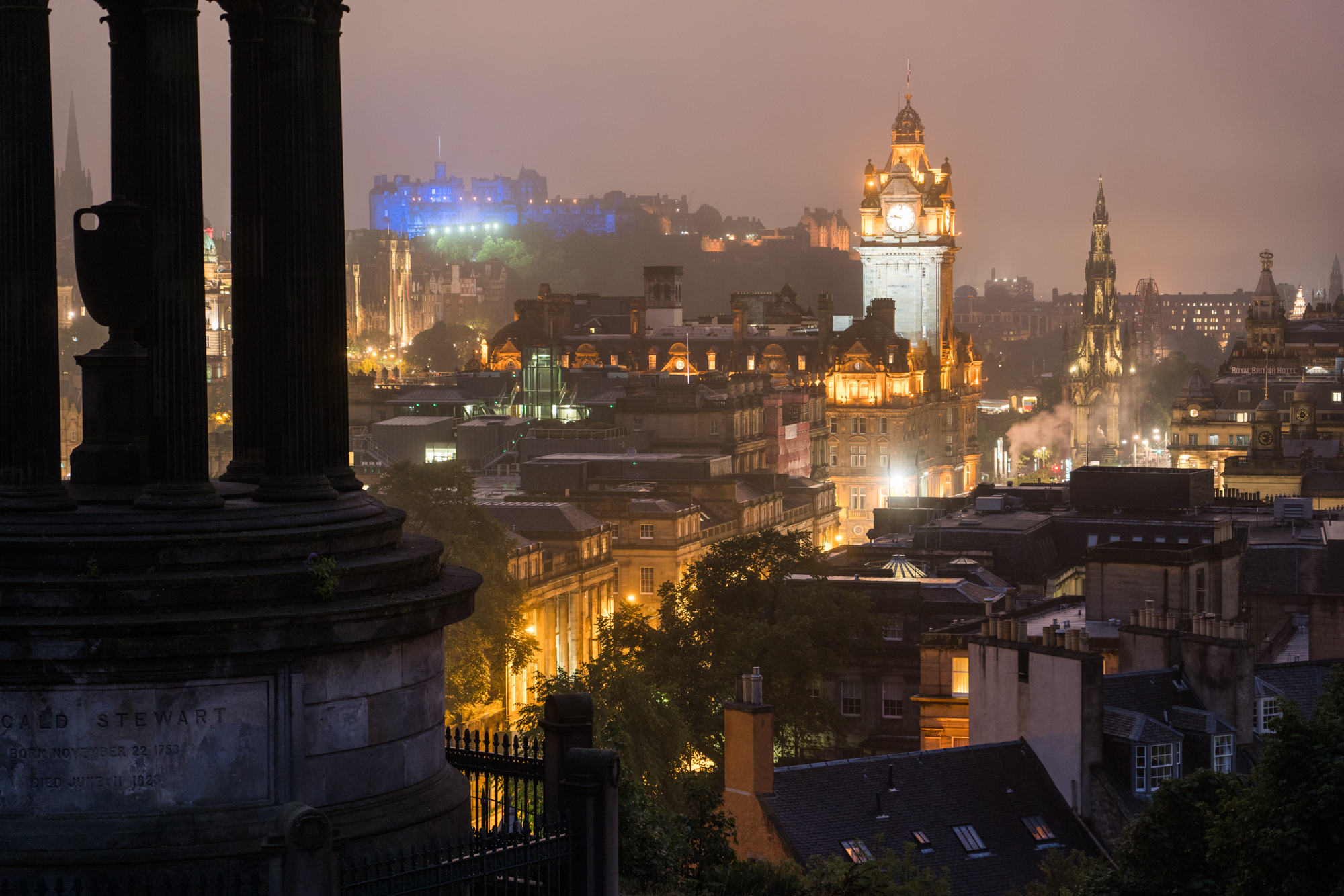  The Balmoral Hotel’s tower and The Edinburgh Castle are illuminated at dusk as seen from Calton Hill. 