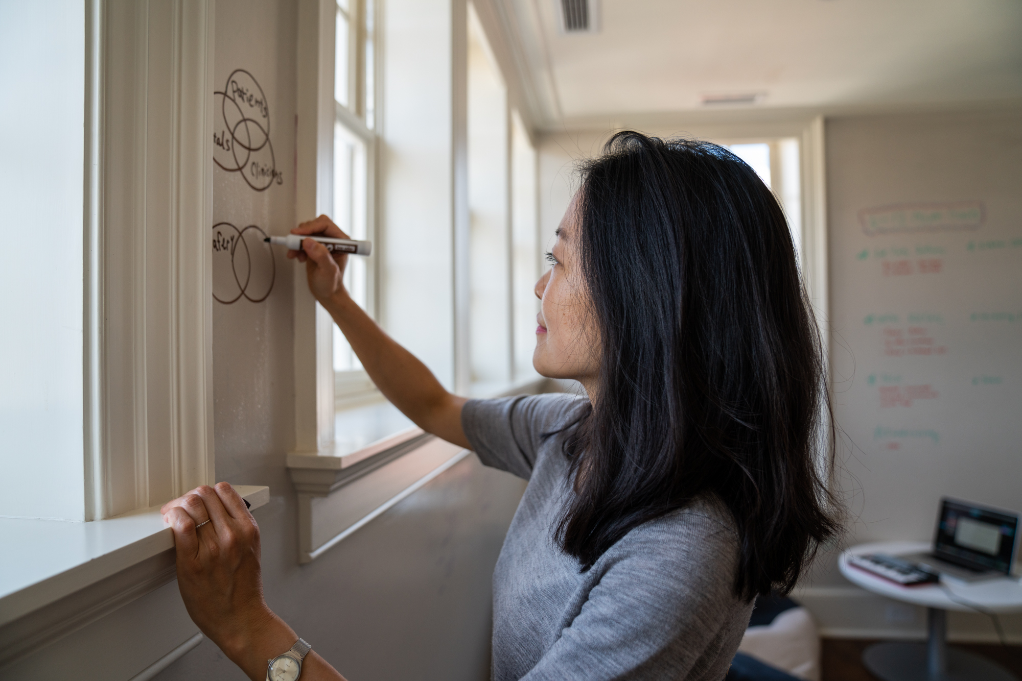 Eric Kruszewski photographs a portrait of Yoko K. Sen in Washington, D.C. Halcyon House for STAT News.