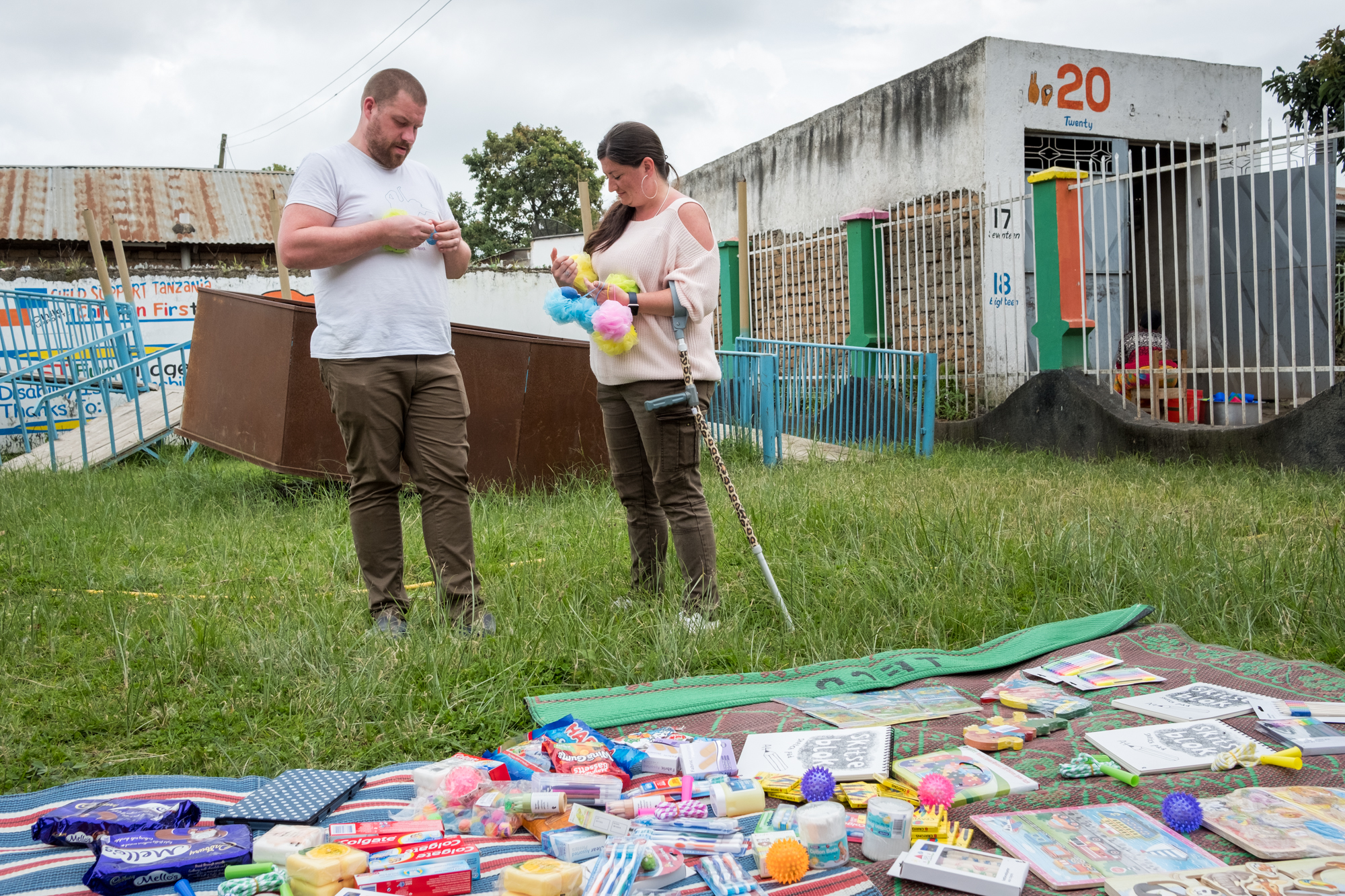  Holly prepares gifts with her partner, Steve, at Child Support Tanzania, a non-governmental organization located in Mbeya, Tanzania, that educates disabled children. For one week of her sabbatical, Steve visited and supported Holly. During that time