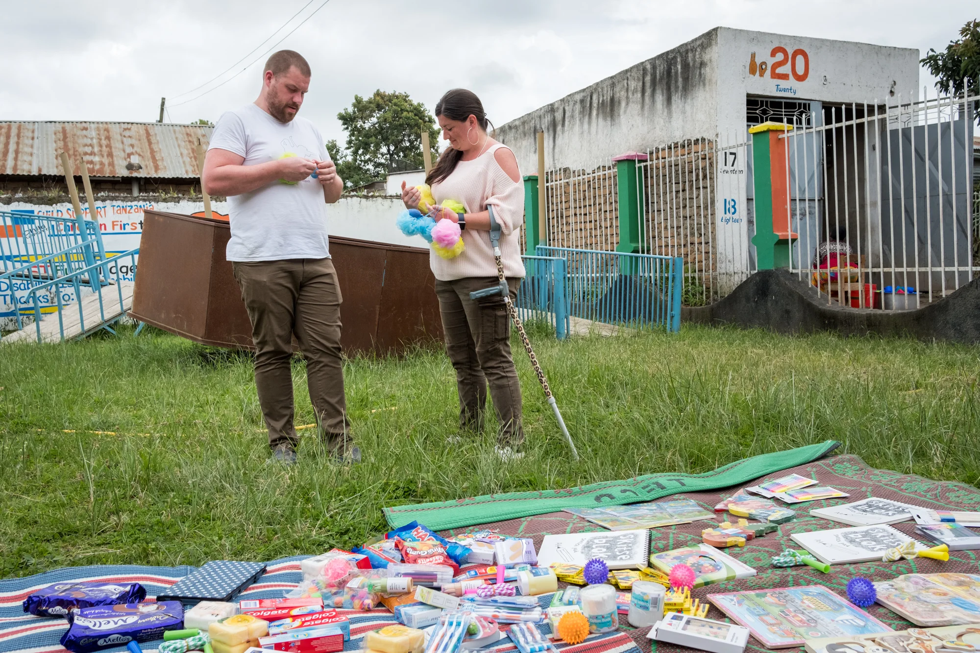 Holly prepares gifts with her partner, Steve, at Child Support Tanzania, a non-governmental organization located in Mbeya, Tanzania, that educates disabled children. For one week of her sabbatical, Steve visited and supported Holly. During that time, they delivered and presented gifts to the students and faculty, including games, books and crayons.