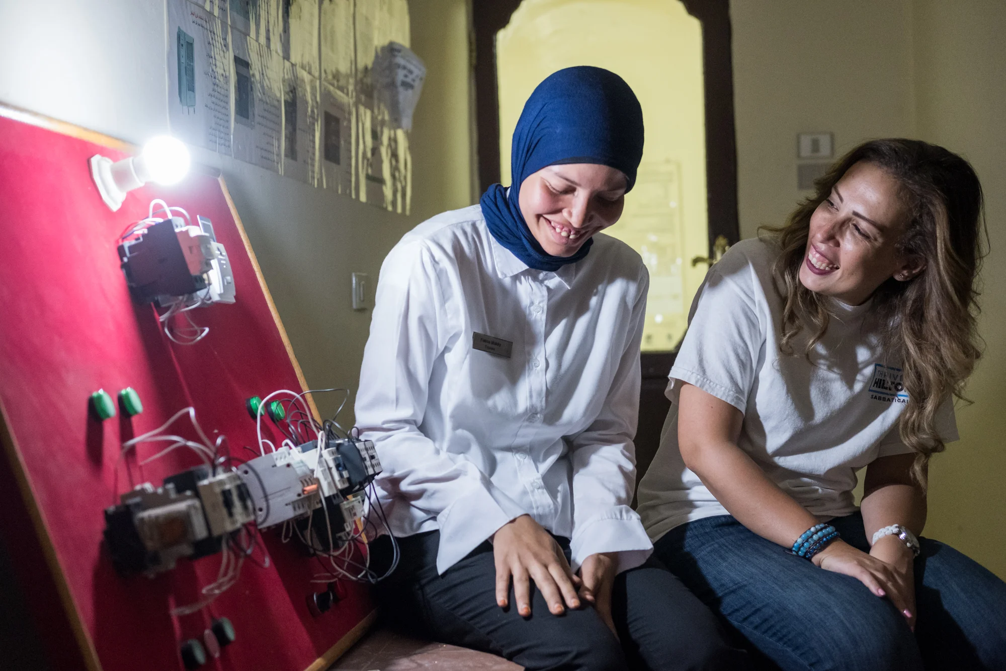 Ingy Helal (right) poses for a portrait with Fatma (left), a trainee in the Engineering/Electrical Department at Hilton Sharm Waterfalls Resort in Sharm El Sheikh, Egypt. Ingy’s training program brought young adults from Upper Egypt into the tourism and hospitality industry.