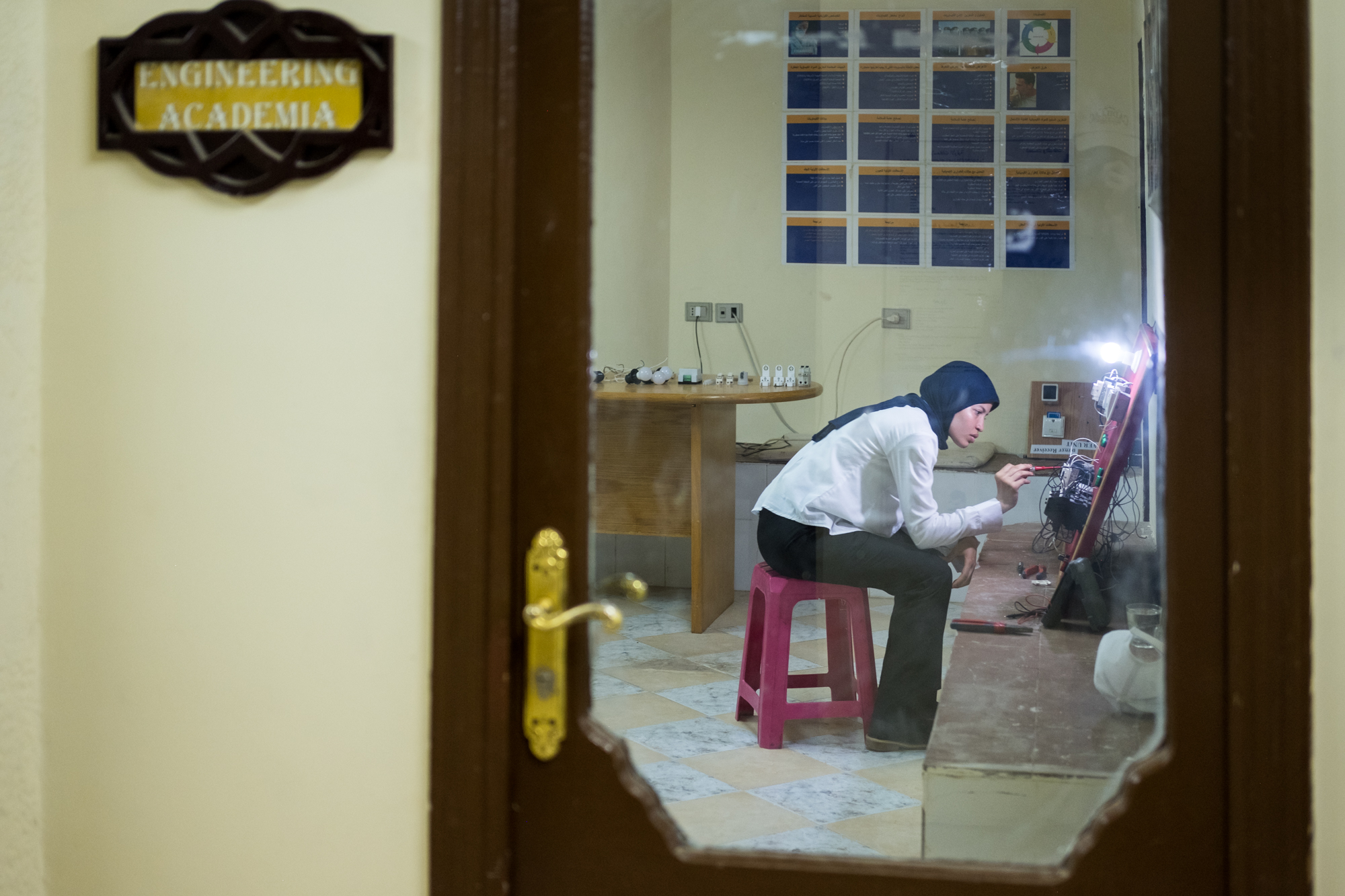  Fatma, a trainee in the Engineering/Electrical Department, works on an electrical circuit. Fatma was the first woman to be in the department, typically a male-dominated role in Egypt. Fatma’s boss was so impressed with her knowledge, so he offered h