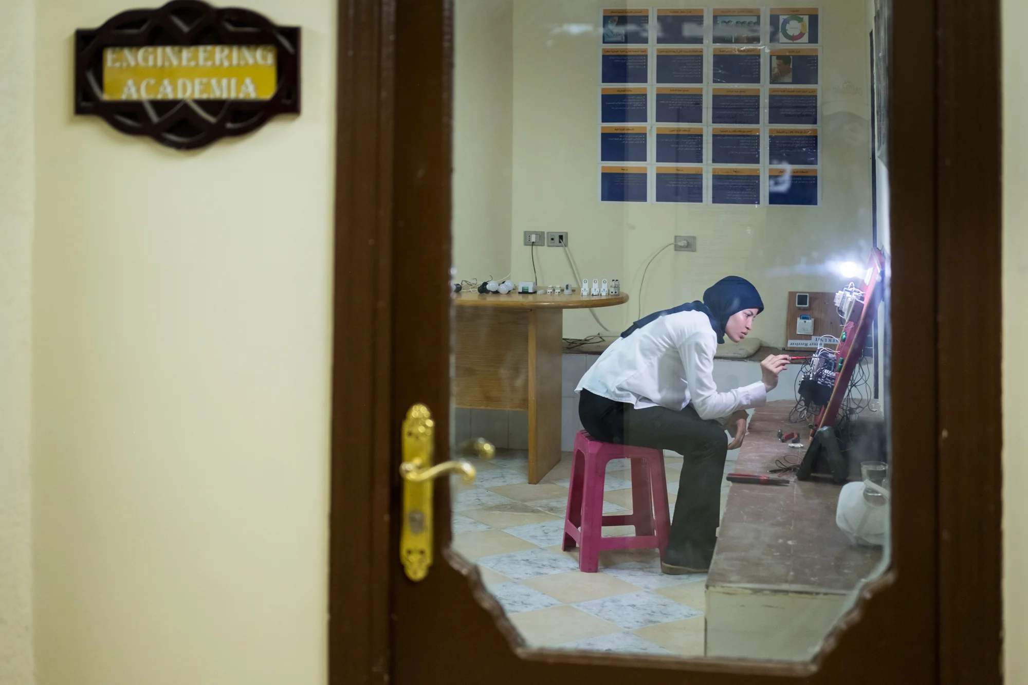 Fatma, a trainee in the Engineering/Electrical Department, works on an electrical circuit. Fatma was the first woman to be in the department, typically a male-dominated role in Egypt. Fatma’s boss was so impressed with her knowledge, so he offered her full-time employment.