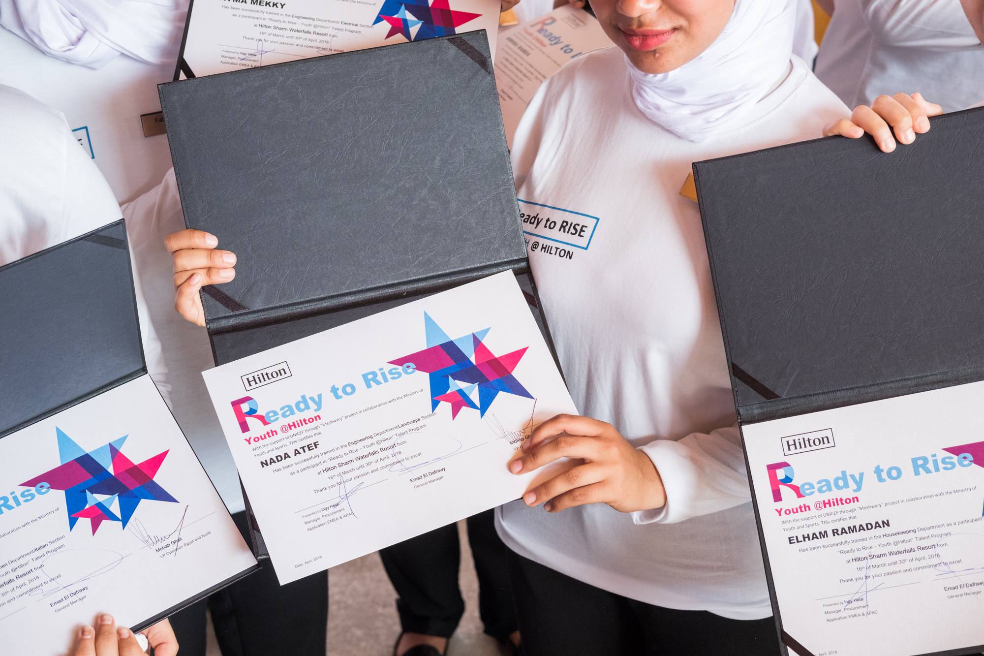  The training program lasts for almost two months. After a ceremony honoring the trainee participants, a few of them showcase their training completion certificates. 