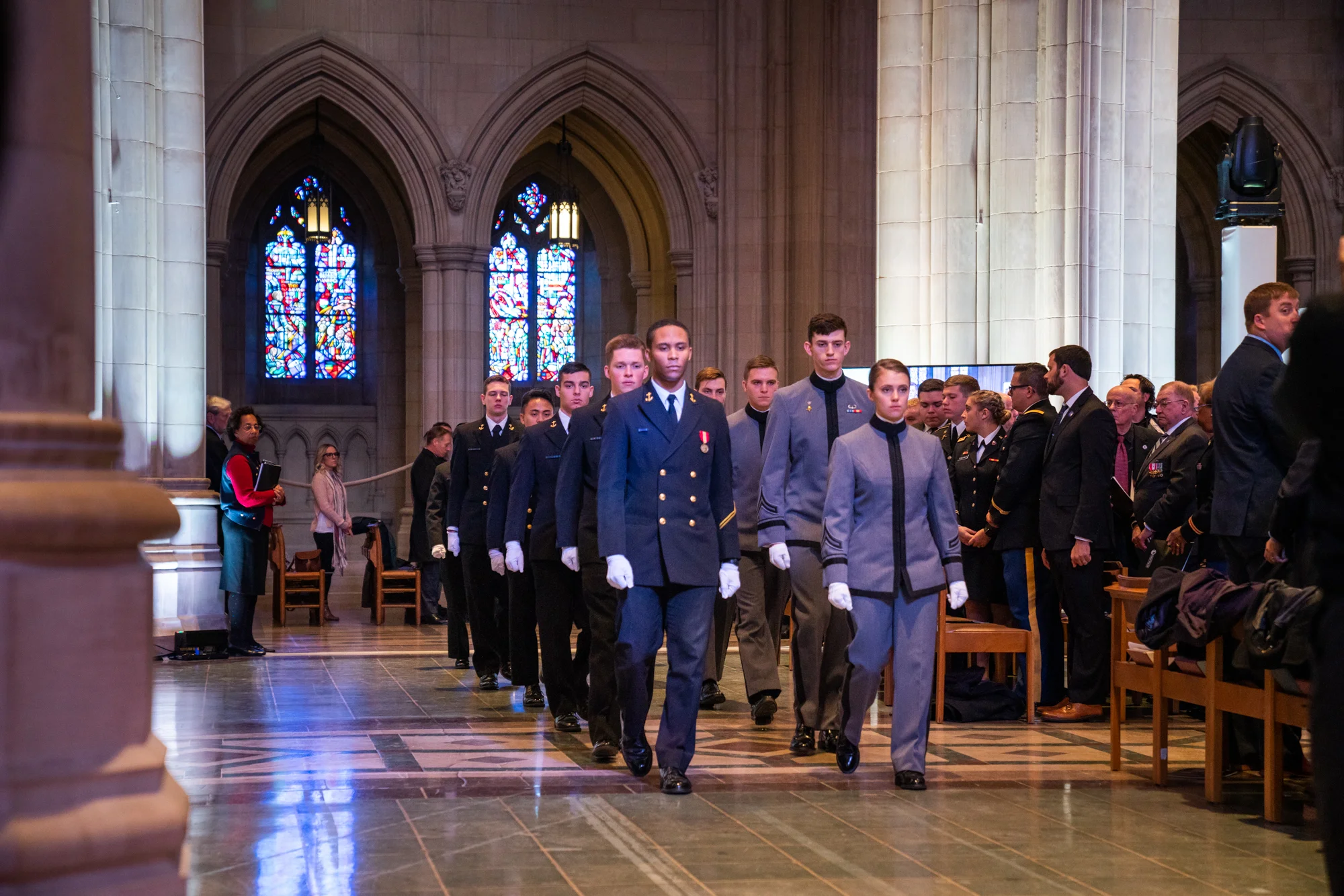 Members of the Corps of Cadets, United States Military Academy, and Members of the Brigade of Midshipmen, United States Naval Academy, prepare for the presentation of the centennial wreath.