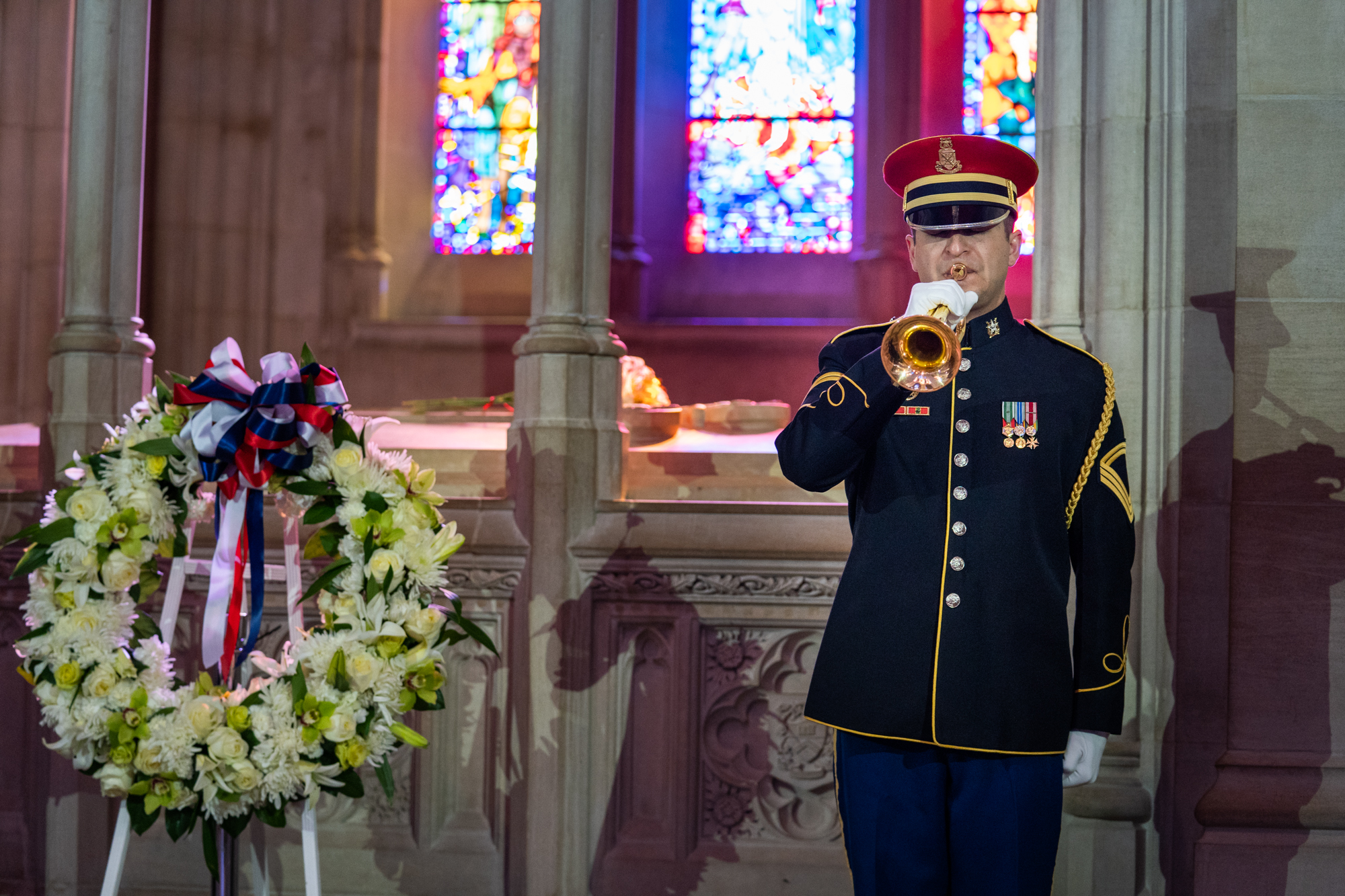  A member of the U.S. Army Band plays Taps while standing alongside the centennial wreath. 