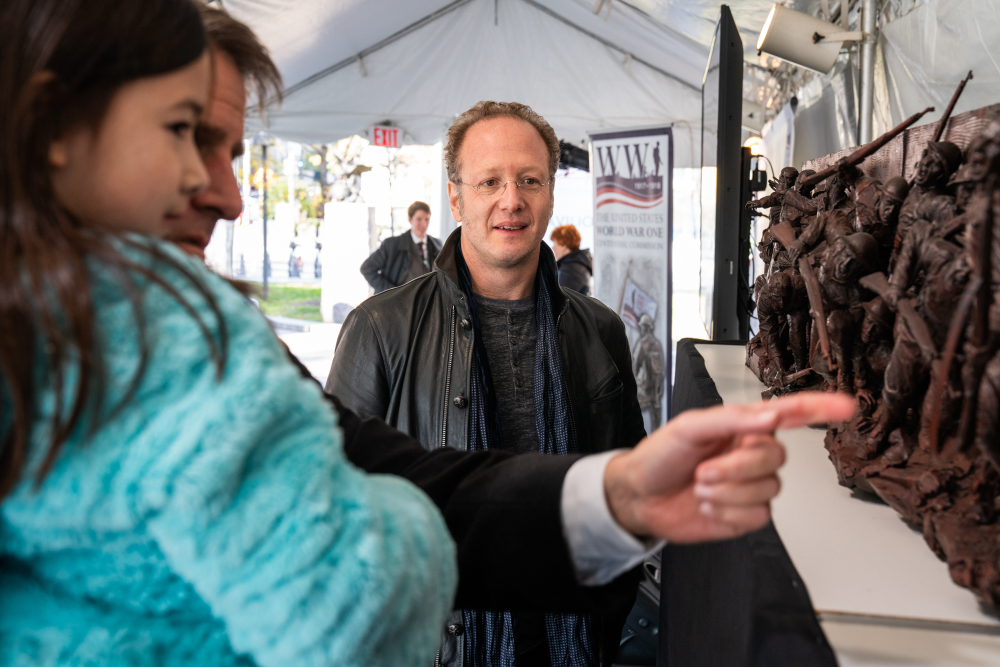  Sabin Howard (center), the memorial sculptor, stands by as Edwin Fountain, World War I Centennial Commissioner, explains the sculpture to his daughter. 