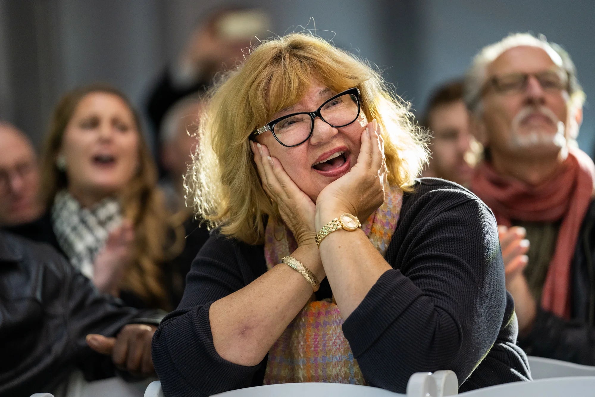 An attendee enjoys the 369th Experience Band’s musical performance.