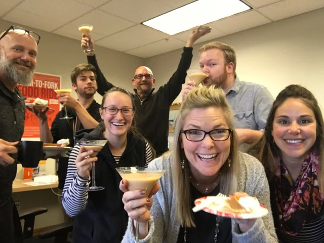 Enjoying pre-Thanksgiving revelry, complete with pumpkin refreshments