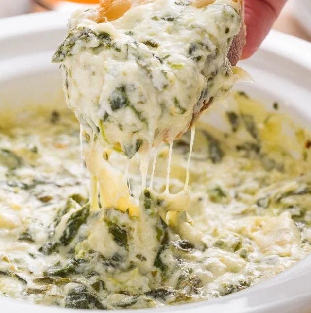 gallery-1447685111-delish-slow-cooker-dip-artichoke-1.jpg
