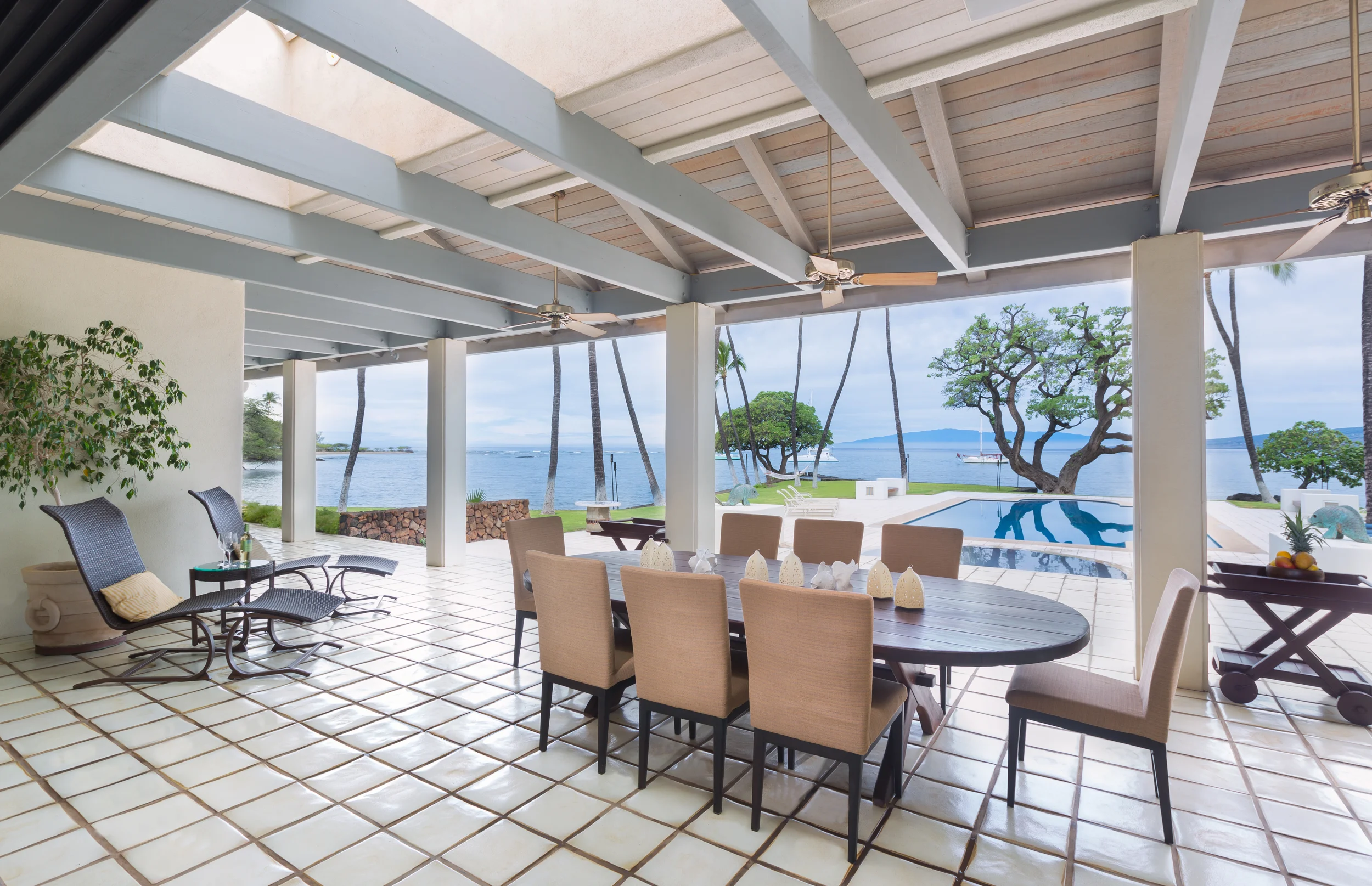 Covered outdoor lanais provide the best of outdoor living and entertaining at this oceanfront home.