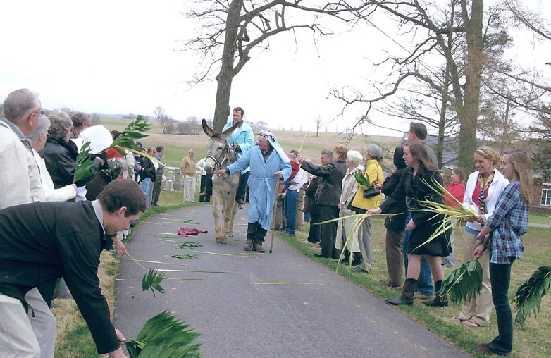 Congregation members reenact biblical events in celebration of Palm Sunday.