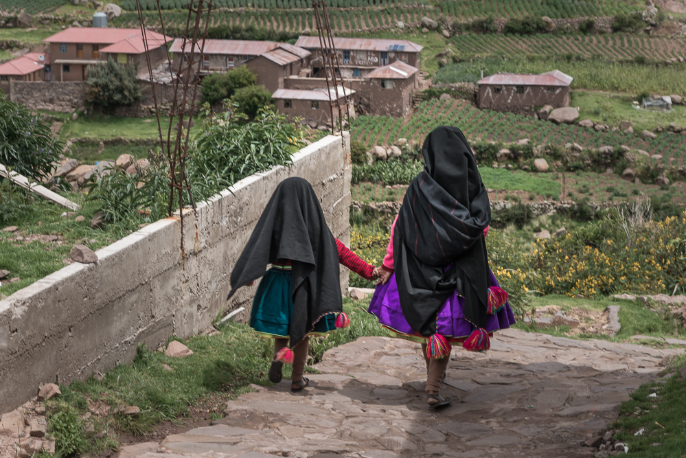 The black shawl is worn by Taquilenos who are volunteering for the community.