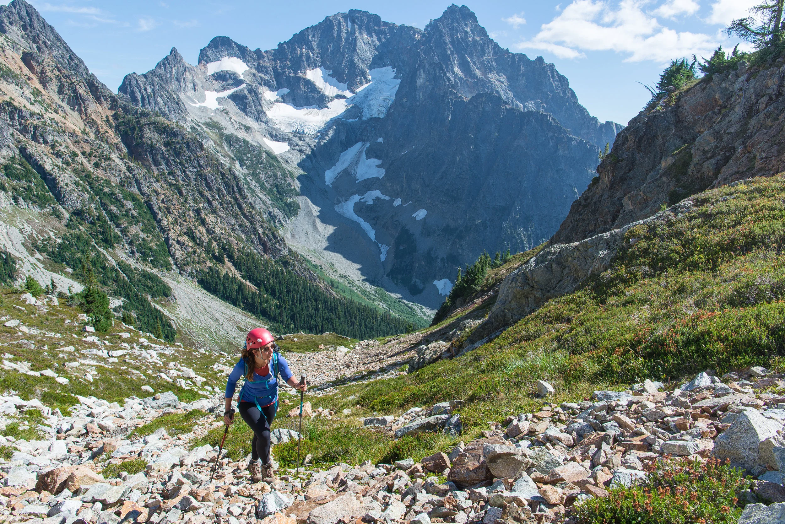 Holly (@missholldoll) hiking with Black Peak in the background.