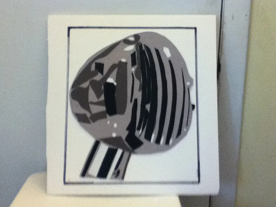 Black, gray, and white paper cut-out artwork of a snail shell on a white background.