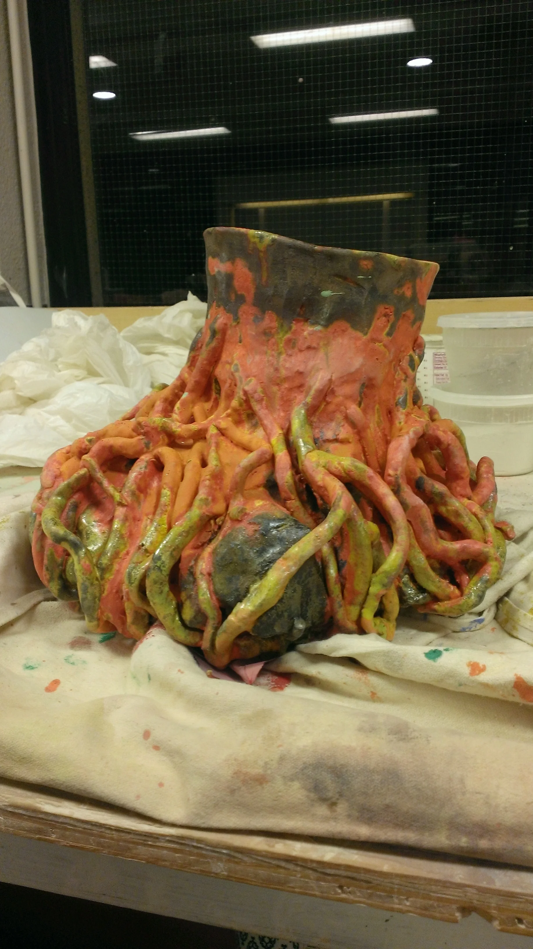 A sculpture of a tree trunk with protruding roots.