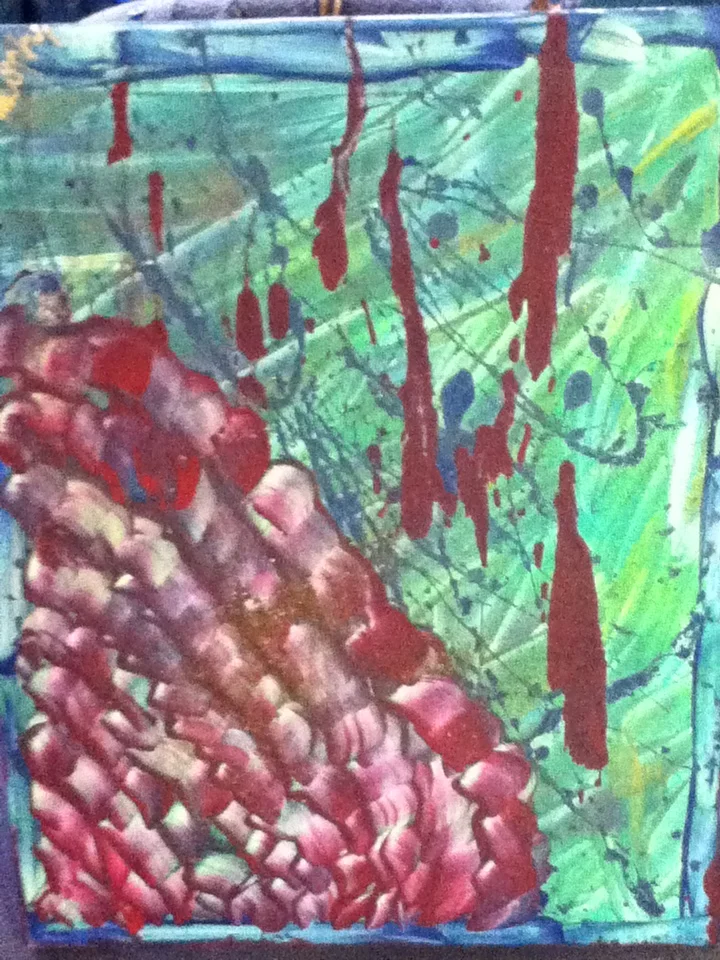 Abstract painting featuring splatters of red, blue, and green paint with a textured section of pink and purple at the bottom left corner.