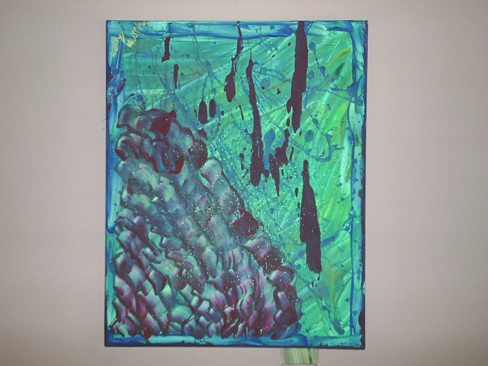 Abstract expressionist painting with blue, green, purple, and black splashes and strokes, featuring a textured, layered surface.