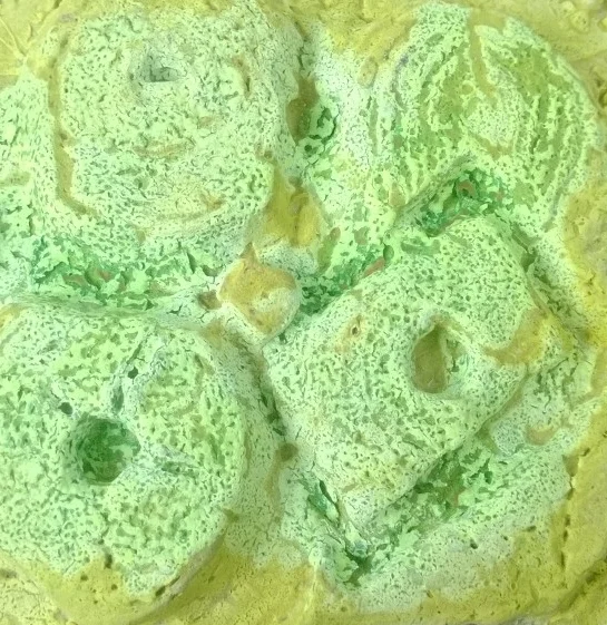 Close-up of sliced cucumber with a greenish tint.