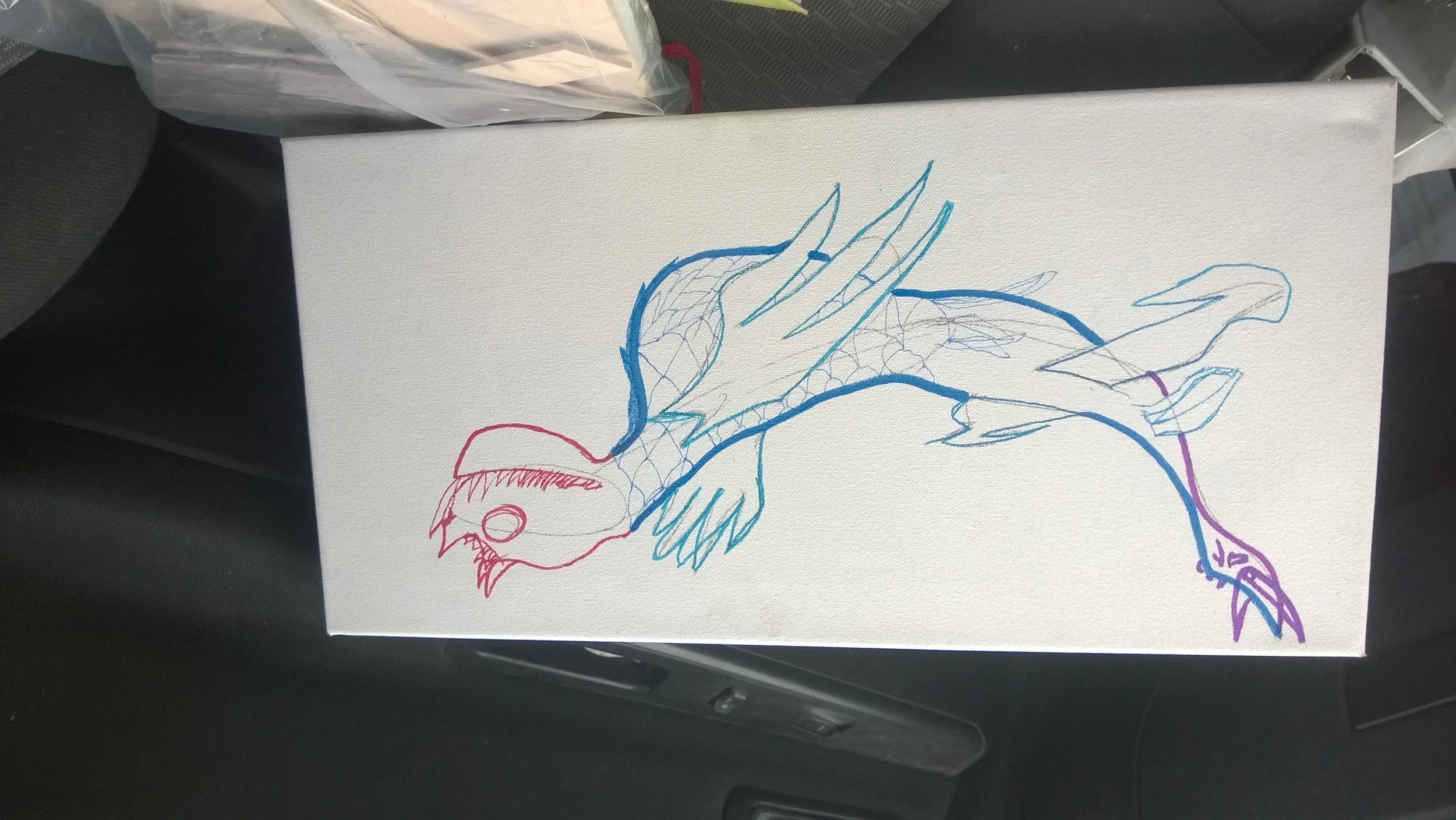 Line drawing of a dragon on a white canvas, with parts colored in red, blue, and purple.