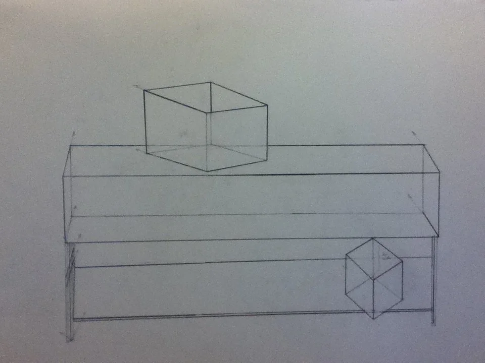Sketch of a 3D geometric drawing featuring two cubes, one larger on a band and a smaller on the right side.