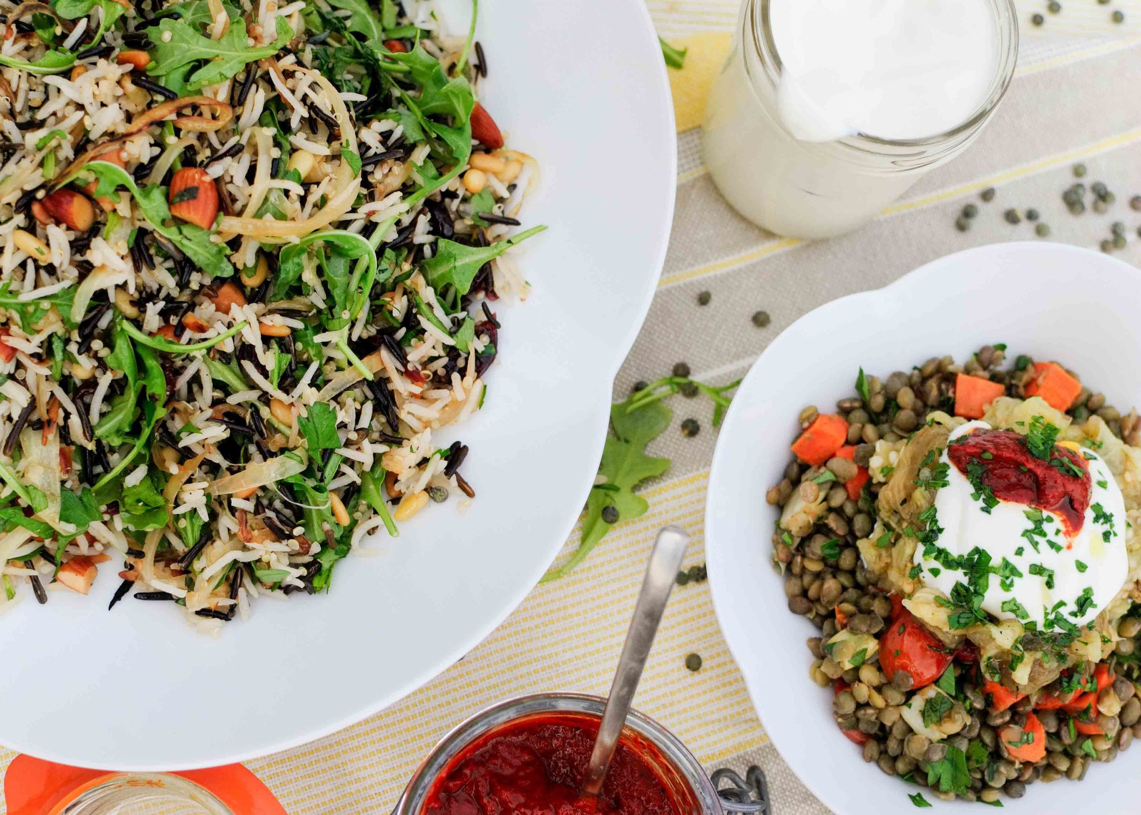 rice salad with nuts and sour cherries and lentils with charred eggplant and harissa