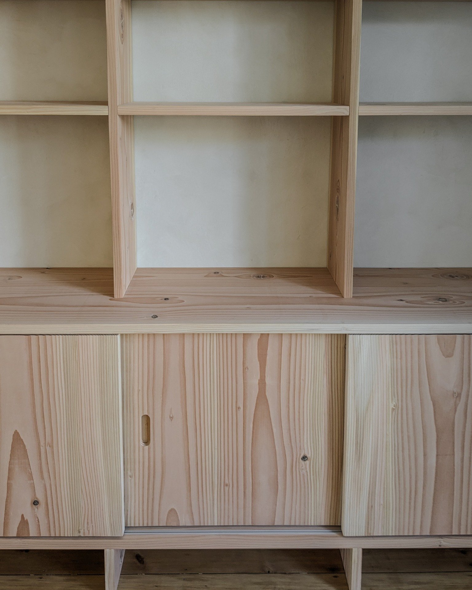 Detail shots of this solid wood Douglas Fir freestanding cupboard and bookcase. The warm pink hue of the Douglas was chosen to compliments this Victorian townhouses color palette and wooden floors.

A few key features:
- Freestanding shelving unit ma