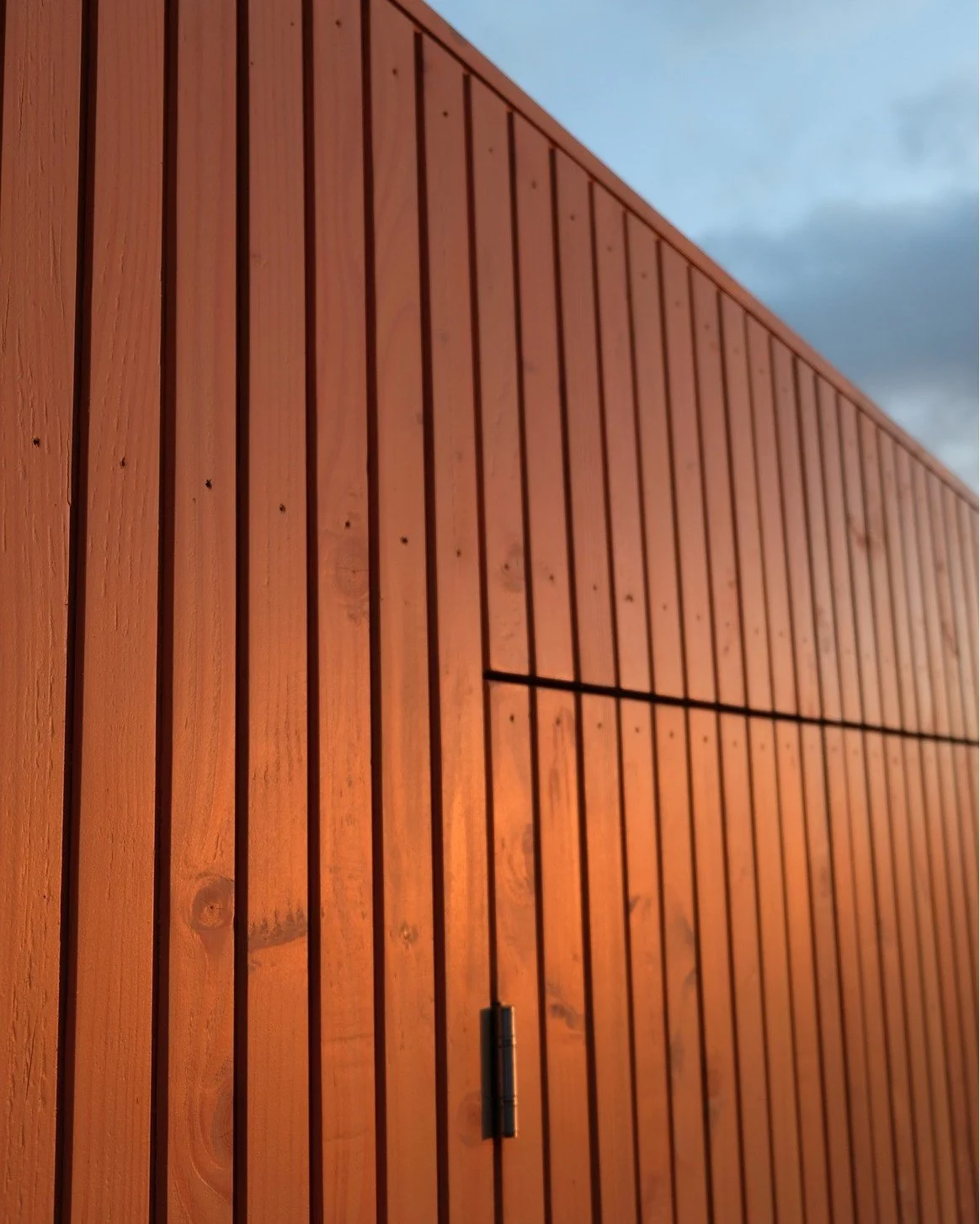 A closer look at the details.

This project was all about the small touches &mdash; the curve of the guttering, the angles of the irregular pergola, and the shadows created by the vertical cladding as the evening light moves across the space.

Carefu