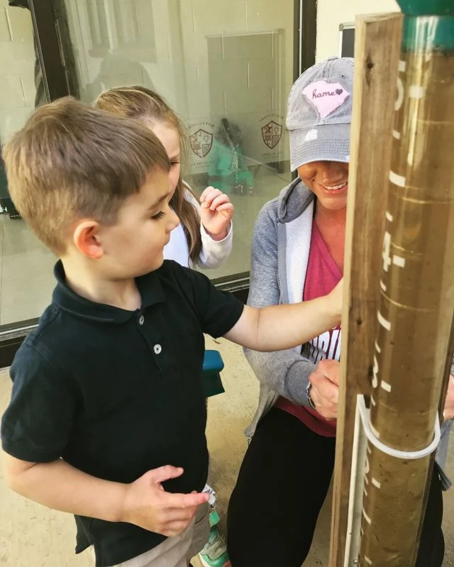 We are enjoying this beautiful weather today. Our EC class (3-6 year old) took to the garden this morning. We are starting to get things ready to plant. And Mrs. Tiffany taught them about our thermometer and rain gauges.