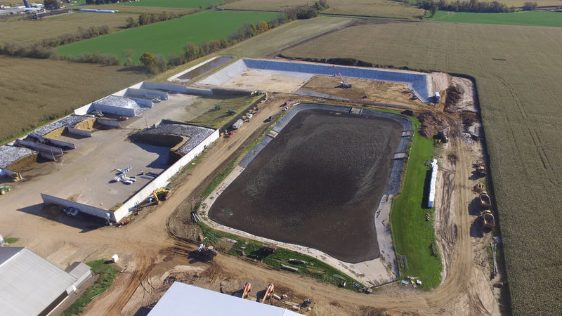 Construction of the Proposed Waste Storage Facility Shown as well as the Completed Feed Storage Area Expansion