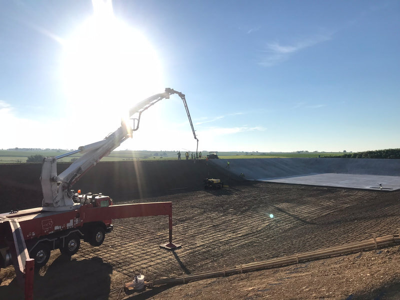 Placing the Concrete Liner on the Proposed Waste Storage Basin