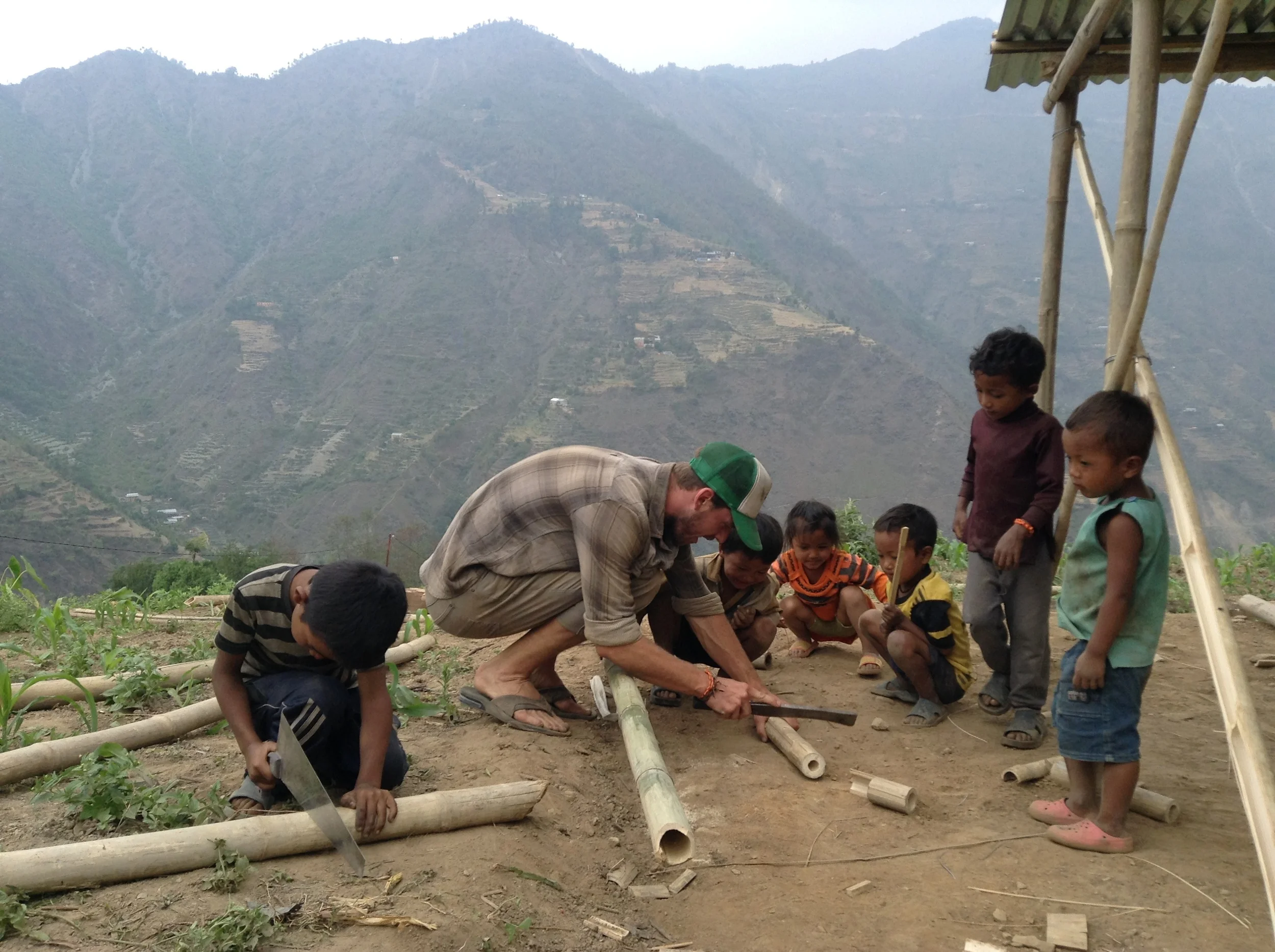  Sean takes a break from building to make a toy for the kids 