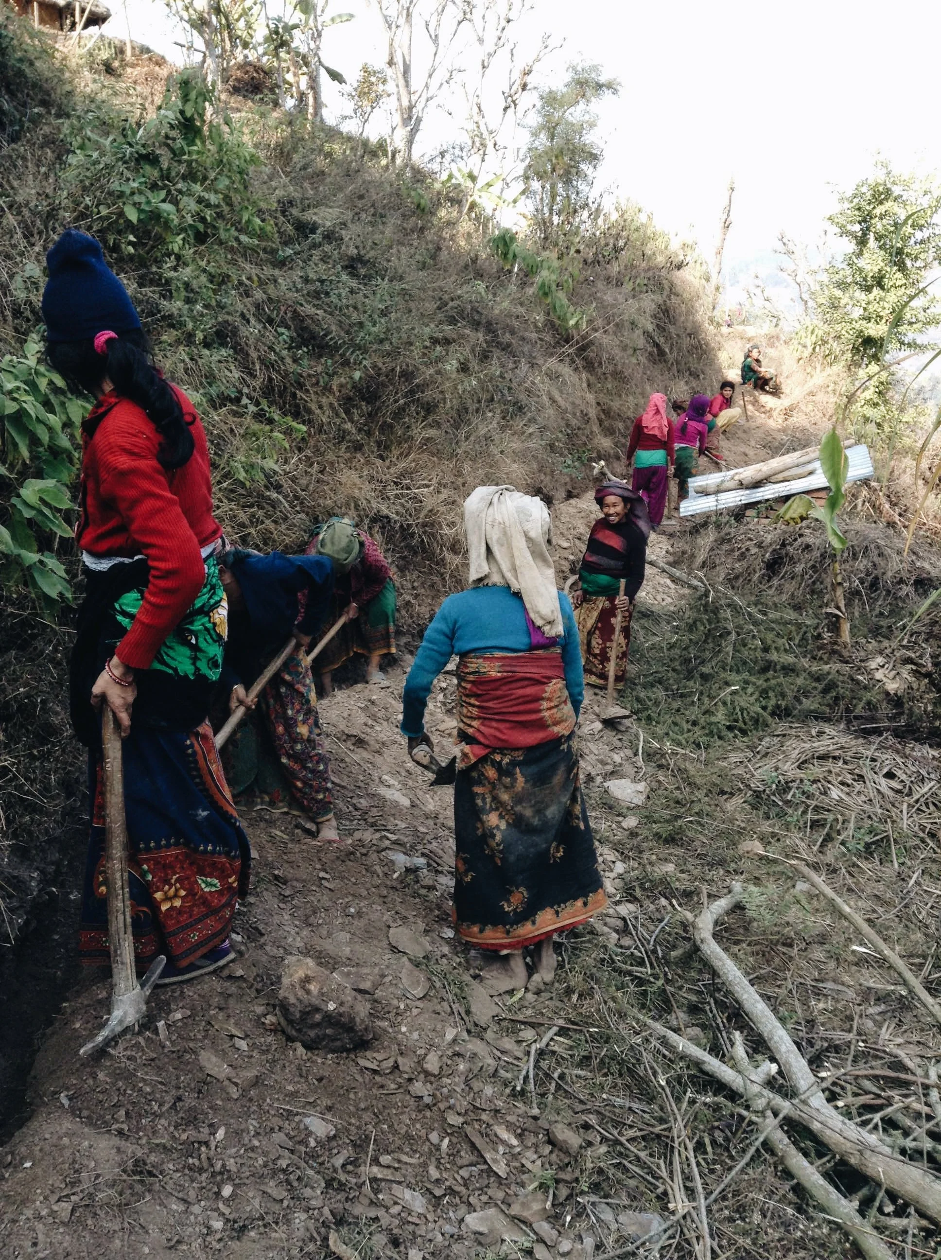  Women digging the trench for the pipeline 