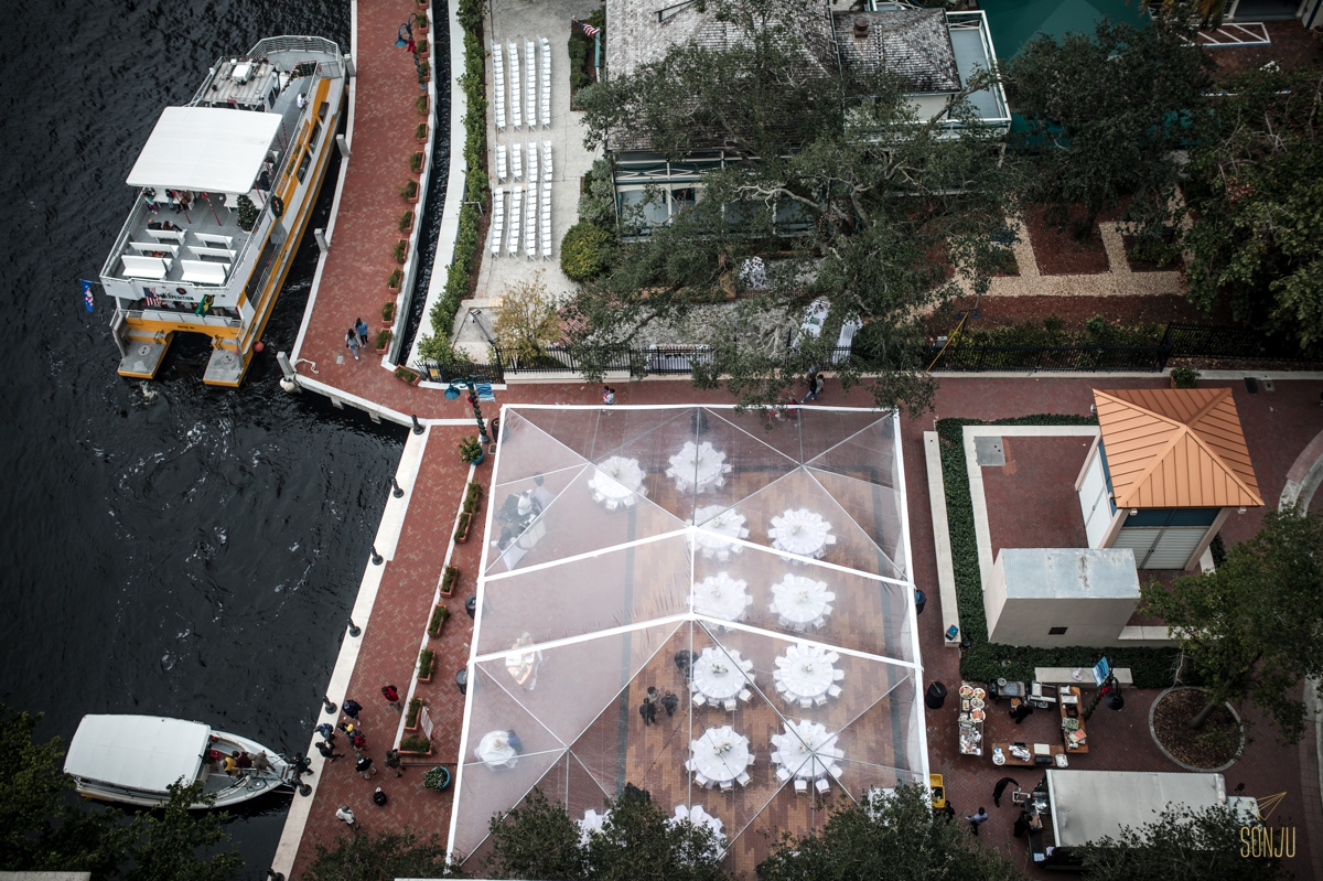 Aerial view of the Stranahan House in Fort Lauderdale Florida. Outdoor reception on the water under a clear tent. 
