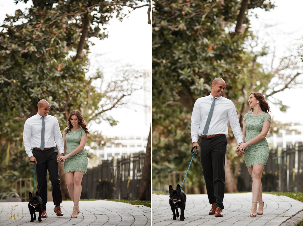 Bride and Groom to-be walk with their Frenchie in a park in Brickell Miami 