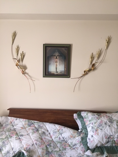 Making sure these special pieces were hanging in this arrangement above Mrs. A's bed in her new residence was an important factor in our resettling process.