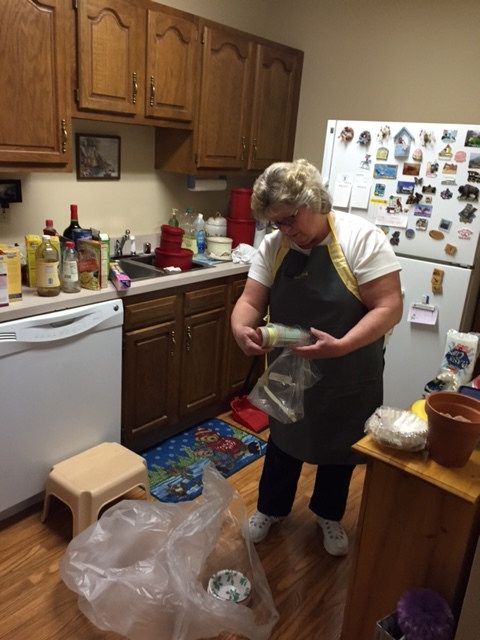 Melanie, one of our team members, carefully sorting and packing years worth of items in Mrs. A's apartment.