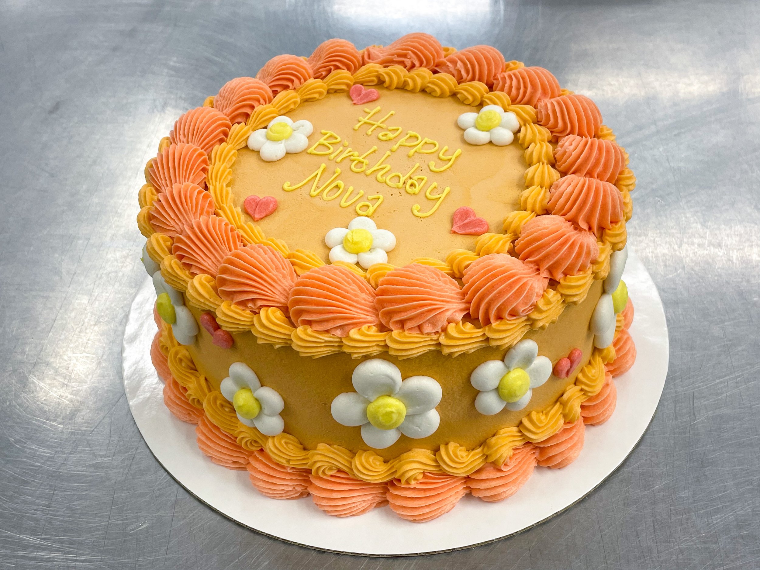 Yellow and Orange Daisy Cake(Floral 9 $15, Colored frosting $5, Different colored borders $5).JPG