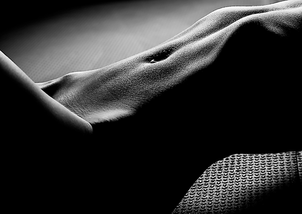 Fine Art Nude Photograph of a woman's stomach in black and white