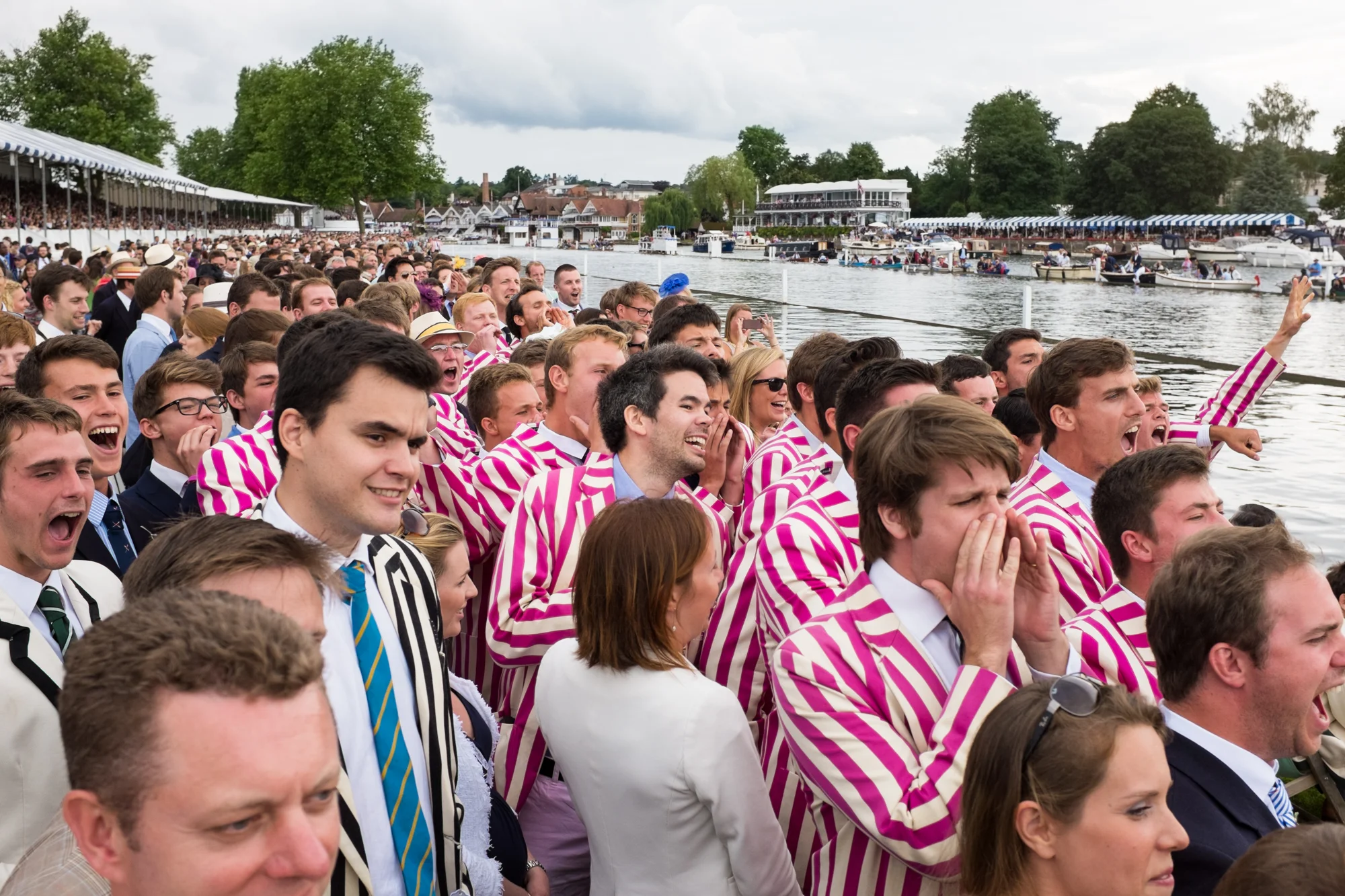 Spectators from Abingdon School cheer on their classmates in the Princess Elizabeth Challenge Cup at Henley Royal Regatta.