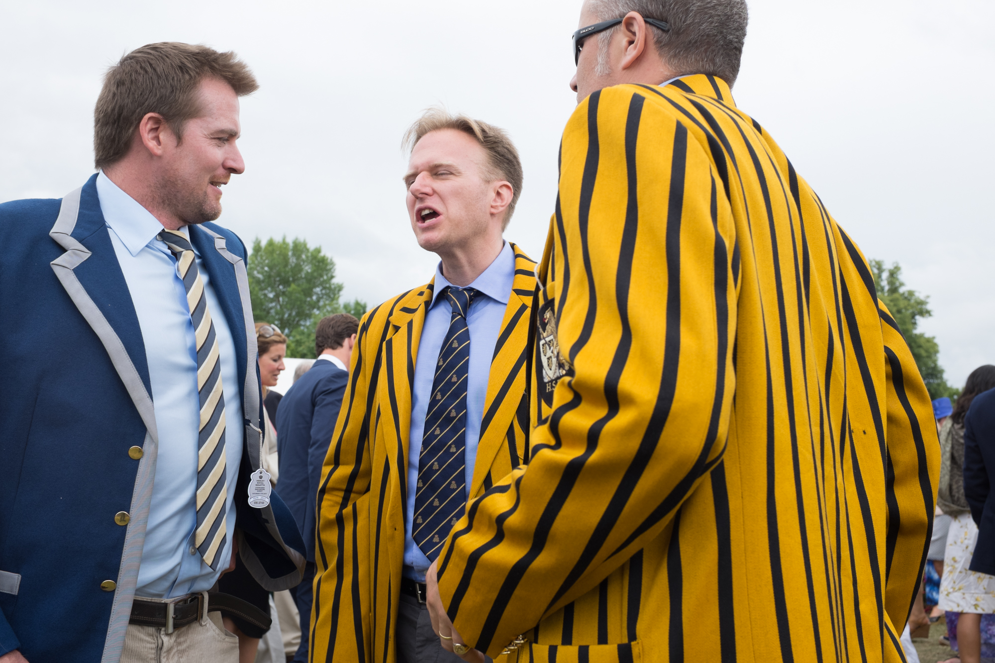  Catching up with friends at Henley Royal Regatta. Lots of spectators have been coming to the regatta for a great many years, and still wear their club colours with pride. 