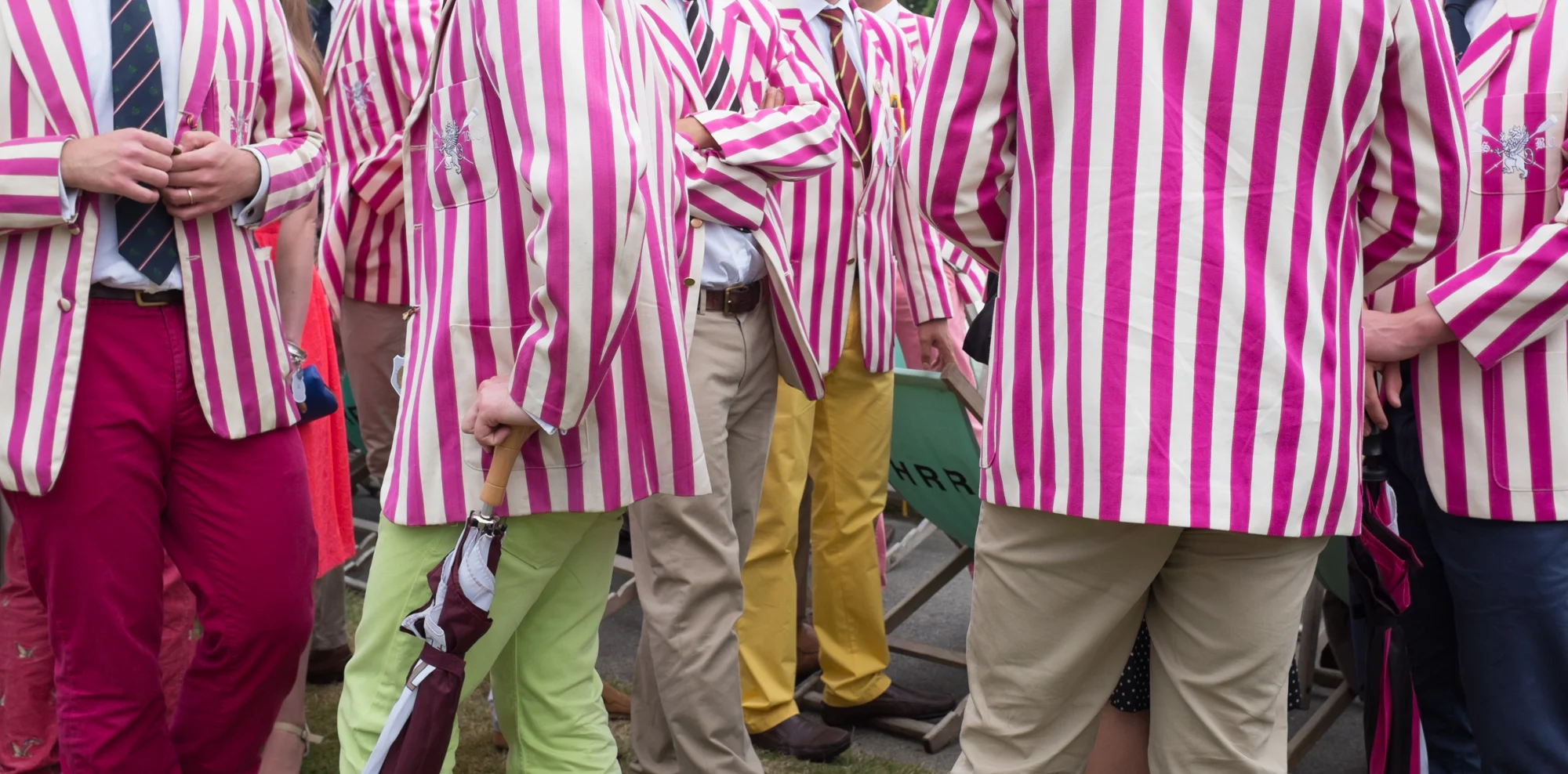 Rowers from Abingdon School, wearing their distinctive blazers, mingle with the crowds at Henley Royal Regatta.
