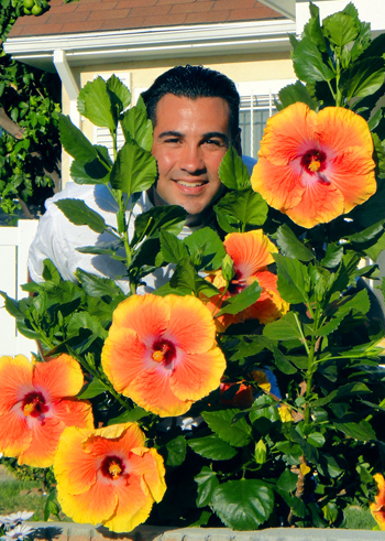 Darren with a young Acapulco Gold plant in 2011. Yes the blooms are almost as large as my head!