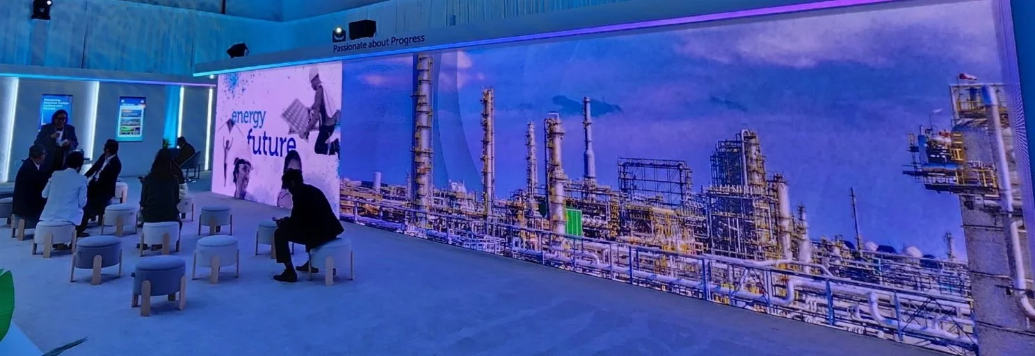 Corporate event setup with blue ambient lighting, stage wash, and modular backdrops, ideal for conferences, brand activations, and awards ceremonies.