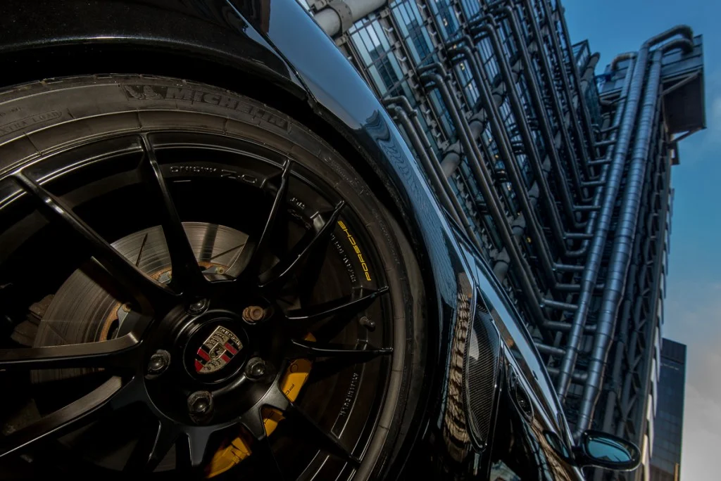 Porsche 996 rear wheel and tyre with London Lloyds building in the background