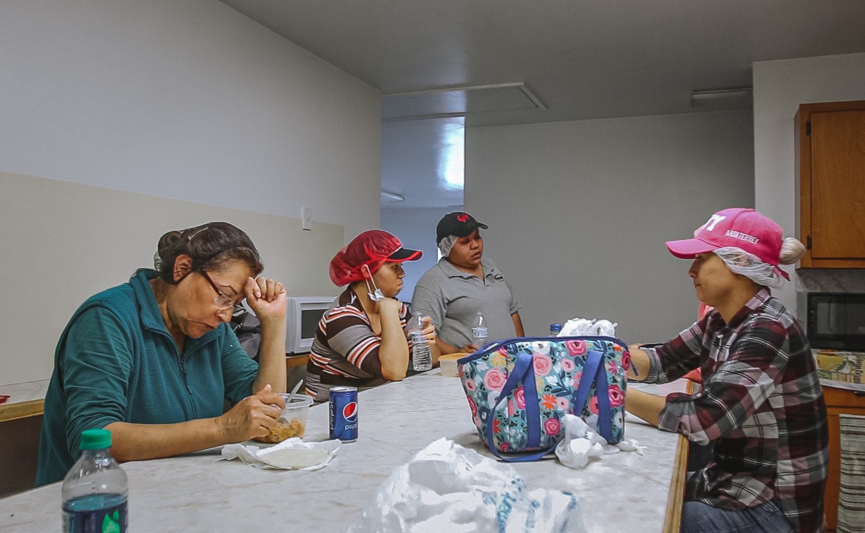  Martha Olivares Garcia, 64, of Veracruz, Mexico, takes her lunch break at one of the living quarters closest to the plant. At 64, Garcia is one of the eldest workers and can no longer pick crabs as her pace has slowed over the years. Instead, she is