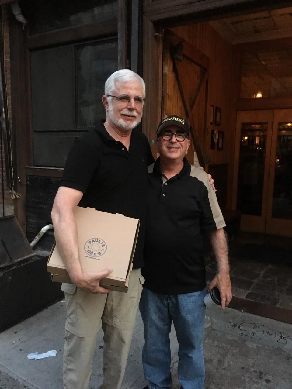 Charlie with Paulie Gee. Of note: The pizza boxes were for leftovers, not take out (this will make sense when you listen to episode #035).