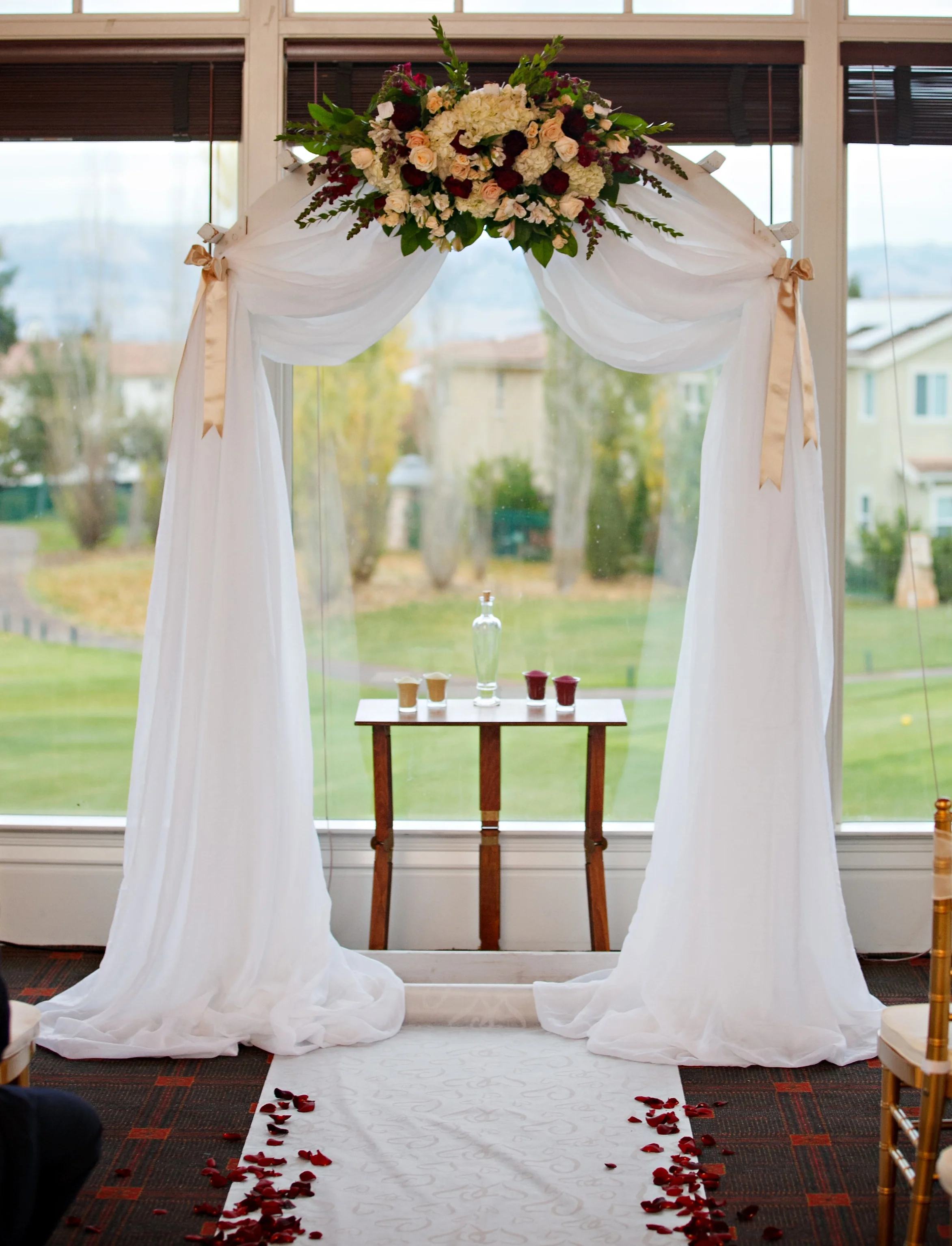 chiffon+drape+on+arch+with+single+spray.jpg