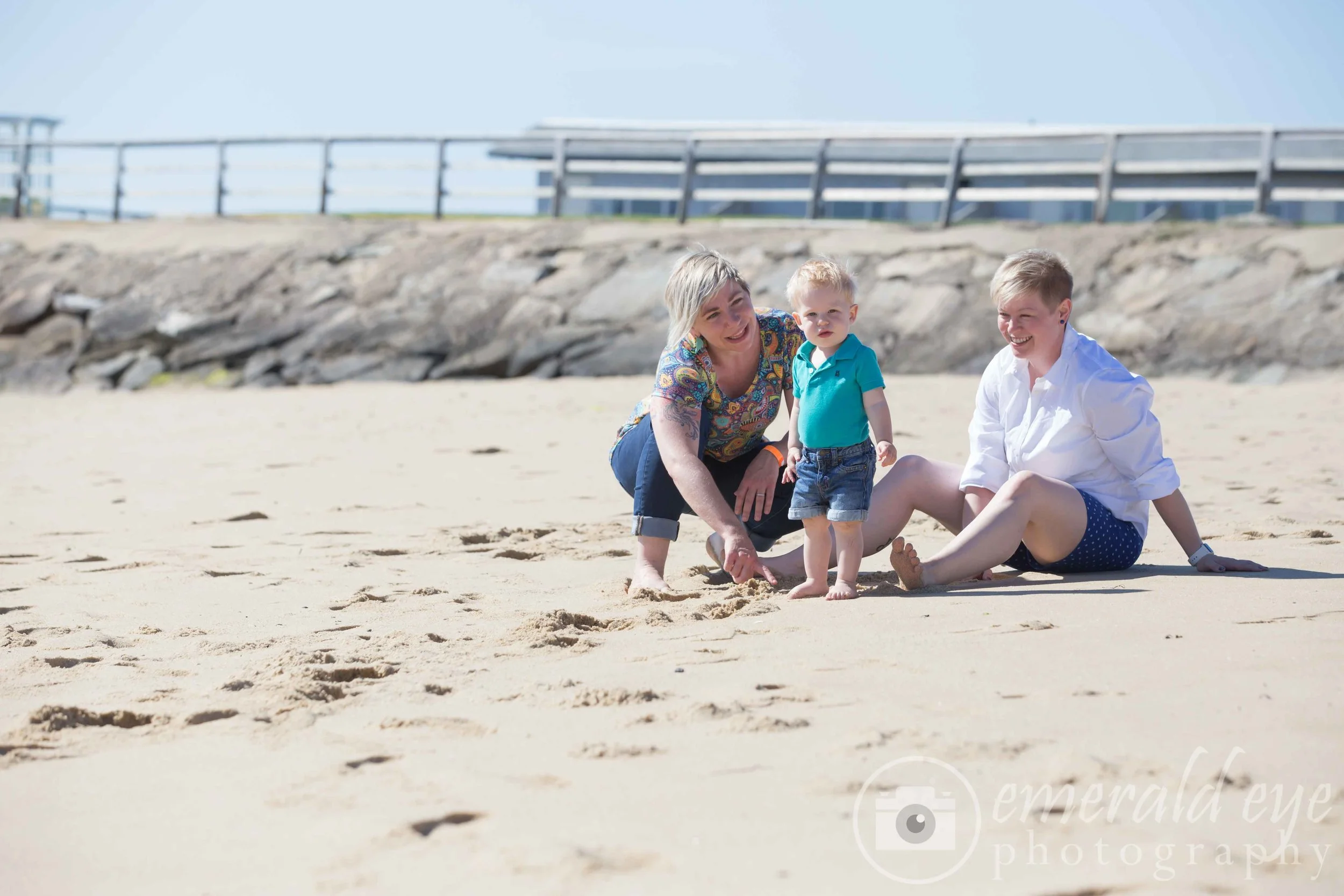 Moms and son play on the beach in Provincetown Massachusetts during Family Week
