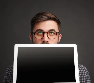 Pensive-man-showing-laptop (Sized).jpg
